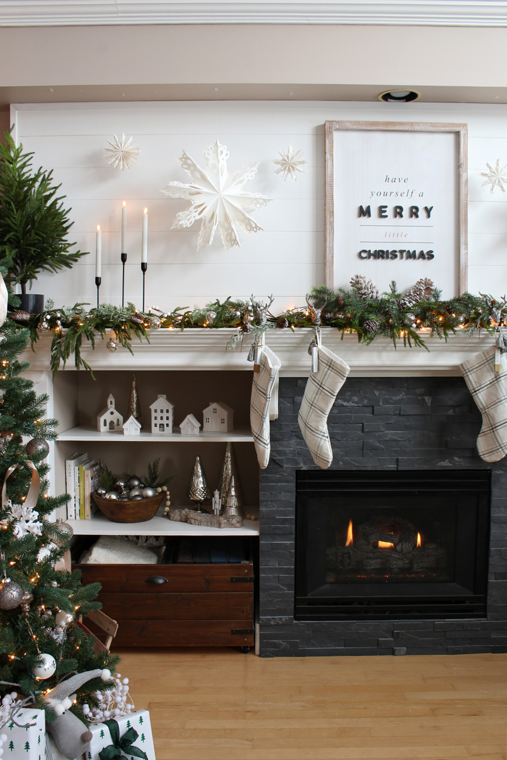 Living room decorated for Christmas with green and white.