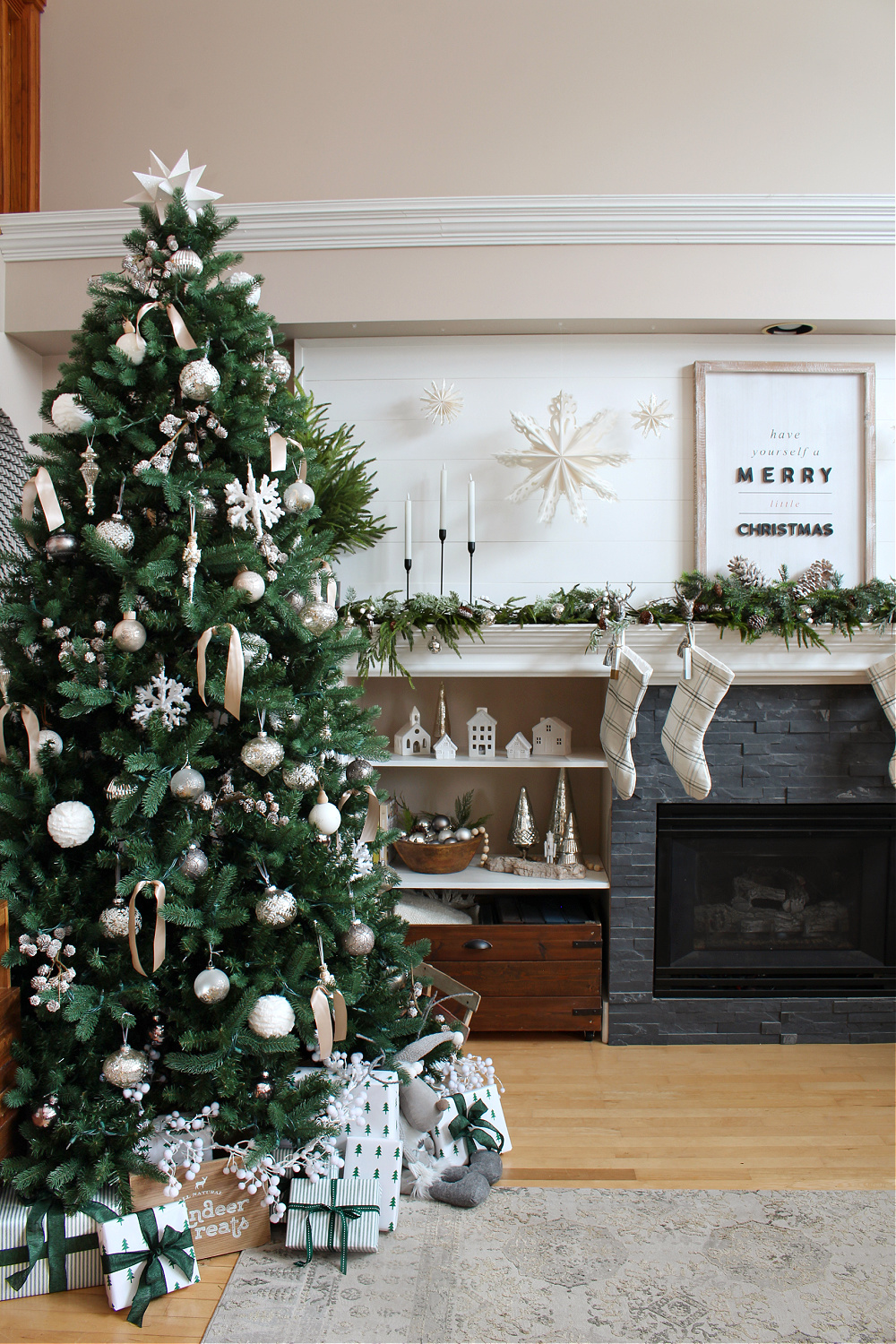 Living room decorated for Christmas with green and white.