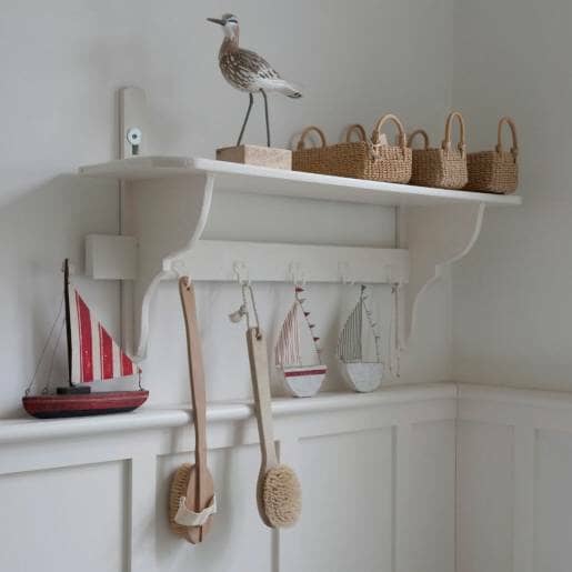 Bathroom shelf with hooks to save space